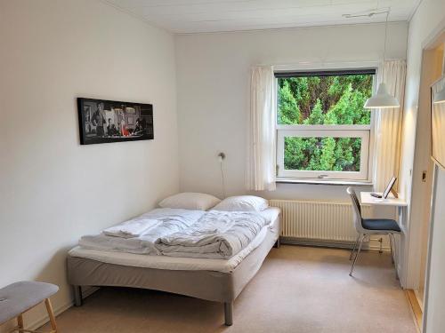 Postel nebo postele na pokoji v ubytování Aarhus Hostel og Hotel