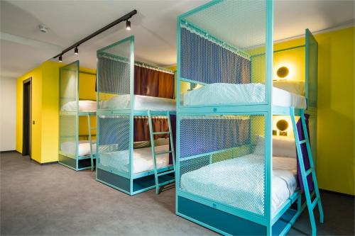 a room with four bunk beds in a room at CX Trieste Giulia in Trieste