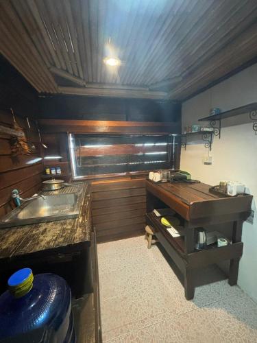 a kitchen with a sink and a counter top at Tonmai Suite II in Ko Por