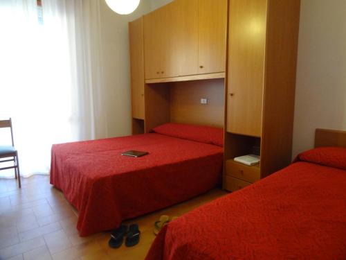 Postel nebo postele na pokoji v ubytování Hotel Residenza Giardino
