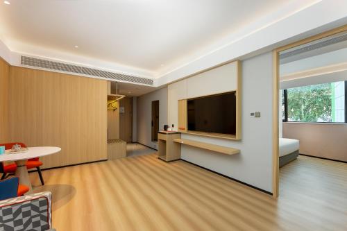 a hotel room with a television and a table at Holiday Inn Express Nanjing Xi'anmen by IHG in Nanjing