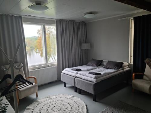 Postel nebo postele na pokoji v ubytování Hietaman Vierastalo Jokipääty