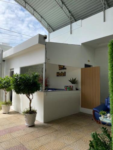 a reception area of a hotel with plants at Maria Hotel in Ba Tri