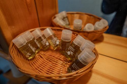 two baskets filled with bottles on top of a table at CasaLiri in Cappadocia