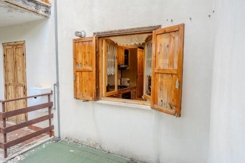 a window on the side of a white building at CasaLiri in Cappadocia