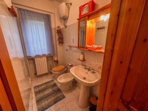 a small bathroom with a toilet and a sink at CasaLiri in Cappadocia