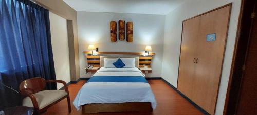 Postel nebo postele na pokoji v ubytování Blue Star Hotel