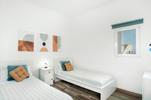 Giường trong phòng chung tại Villa Alegría