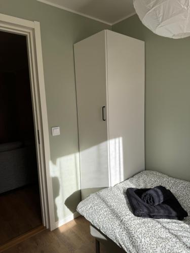 a bedroom with a bed and a cabinet at Rest and Stay in Piteå