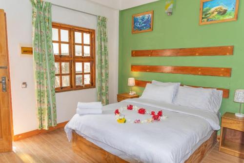 Postel nebo postele na pokoji v ubytování Chao Guest House