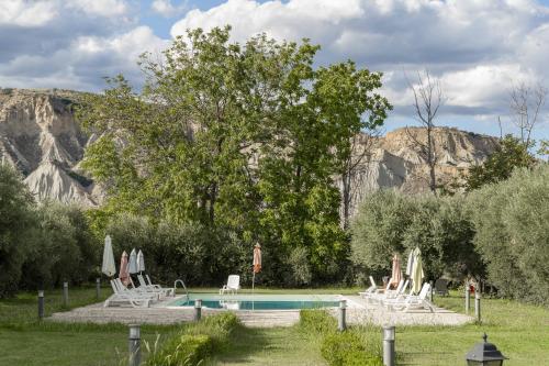 a person standing in front of a swimming pool at Agriturismo B&B La Sterpina in SantʼArcangelo