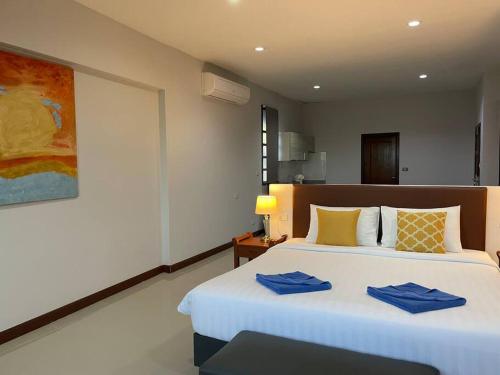 Katil atau katil-katil dalam bilik di Blue Beach Apartment