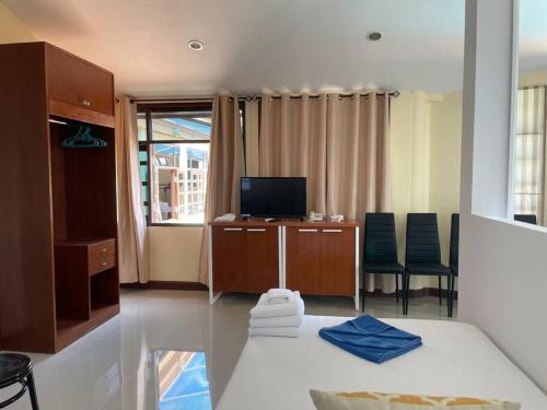 Televisyen dan/atau pusat hiburan di Blue Beach Apartment