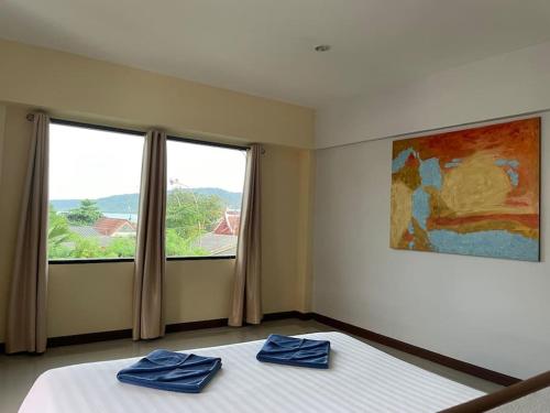 Katil atau katil-katil dalam bilik di Blue Beach Apartment