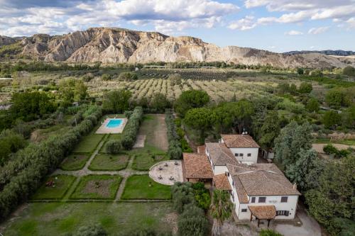 an aerial view of a house with a garden and a pool at Agriturismo B&B La Sterpina in SantʼArcangelo