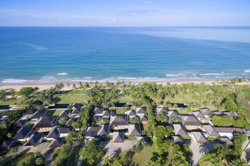 an aerial view of a group of houses near the beach at Villa Ananda at Jivana Beach Villas in Pilai Beach