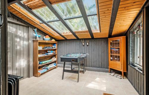 an attic room with a skylight and a table at 2 Bedroom Beautiful Home In Eskebjerg in Eskebjerg