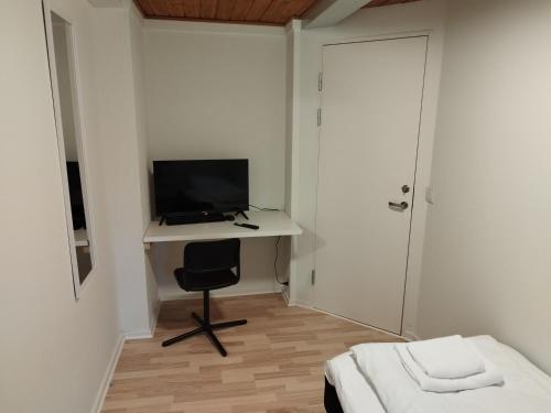 Una televisión o centro de entretenimiento en Fjeldgaard - Aarup