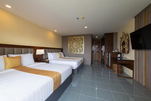 Katil atau katil-katil dalam bilik di Blue Beach Apartment