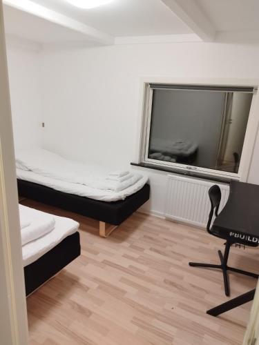 Una cama o camas en una habitación de Fjeldgaard - Aarup