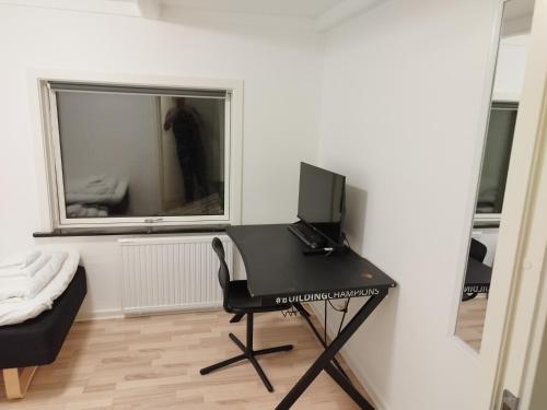 Una televisión o centro de entretenimiento en Fjeldgaard - Aarup