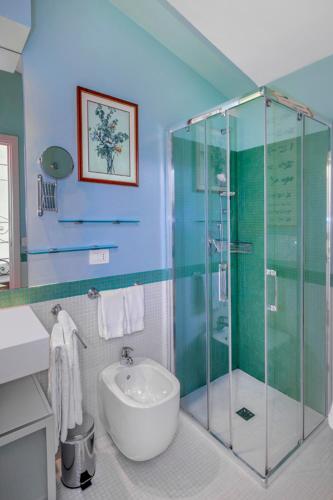 a bathroom with a glass shower and a sink at Residenza Ca De Frati in Arezzo