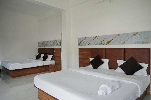 Katil atau katil-katil dalam bilik di Hotel Parmanand Garden