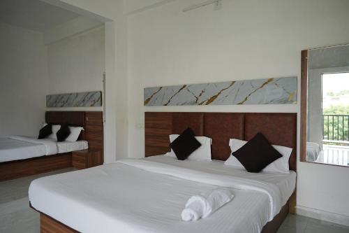 Katil atau katil-katil dalam bilik di Hotel Parmanand Garden
