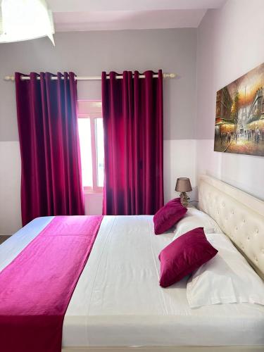 Postel nebo postele na pokoji v ubytování Rose Apartament