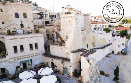 an aerial view of a city with buildings at Tafoni Houses Cave Hotel in Ortahisar