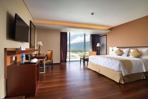 Postel nebo postele na pokoji v ubytování Best Western Plus Coco Palu