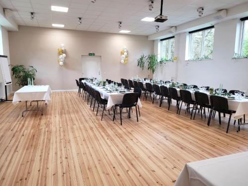 a large room with tables and chairs in it at Aarhus Hostel og Hotel in Aarhus