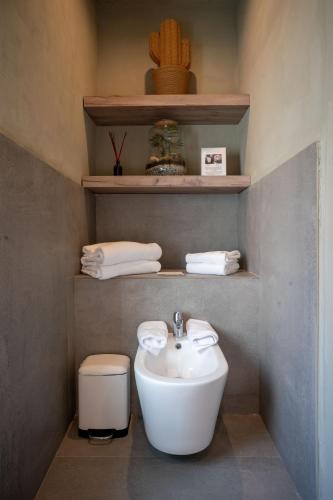 a bathroom with a sink and a toilet at Villa Sassolini Mini Apartament in Montevarchi