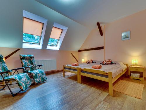 Ένα ή περισσότερα κρεβάτια σε δωμάτιο στο Holiday Home Gościniec Pod Dwoma Sercami by Interhome