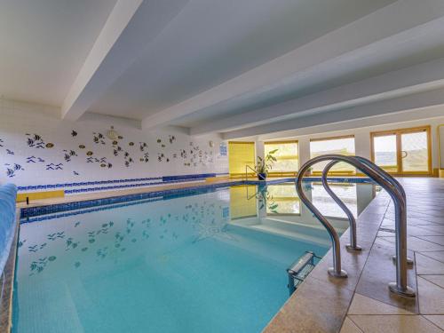 a large swimming pool with a large swimming pool at Holiday Home Borówna-1 by Interhome in Lipnica Górna