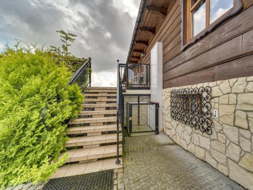 a stairway leading up to a building at Holiday Home Borówna-1 by Interhome in Lipnica Górna