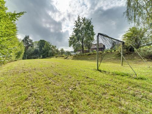 an empty field with a soccer goal in the grass at Holiday Home Borówna-1 by Interhome in Lipnica Górna