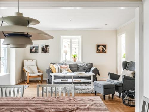 a living room with a couch and chairs at Villa Haveliden by Interhome in Sölvesborg