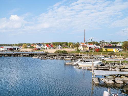 a marina with boats in the water and houses at Villa Haveliden by Interhome in Sölvesborg