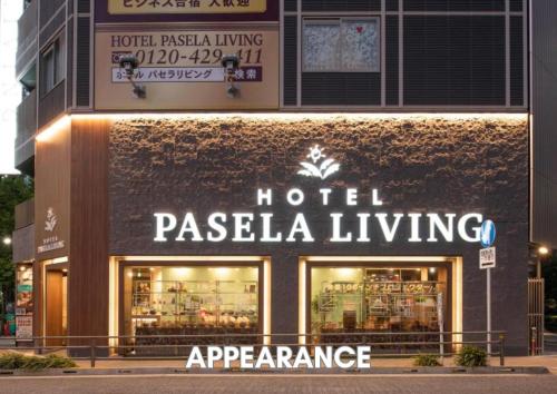 a hotel pasella living sign on the side of a building at Hotel Pasela Living in Tokyo