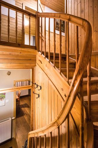 an overhead view of a wooden staircase in a cabin at Chalet Almblick in Fischbach