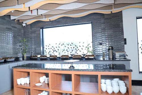 Kuchyň nebo kuchyňský kout v ubytování The Citi Residenci Hotel, Banskopa