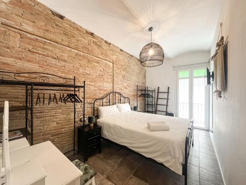 Ένα ή περισσότερα κρεβάτια σε δωμάτιο στο Chic apartment in Girona center
