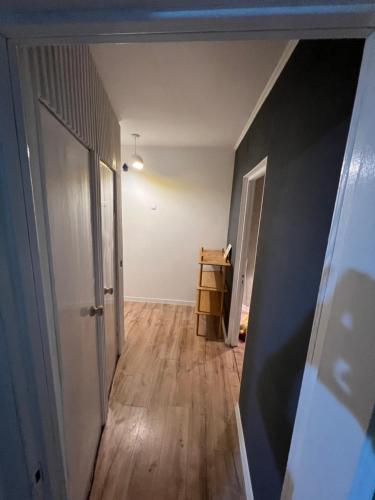 an empty room with a door and a hallway at Rent&live part apartment in Codru