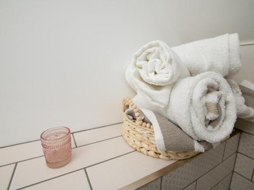 a basket of towels on a counter in a bathroom at Characterful flat by Lincoln Castle Pass The Keys in Lincoln
