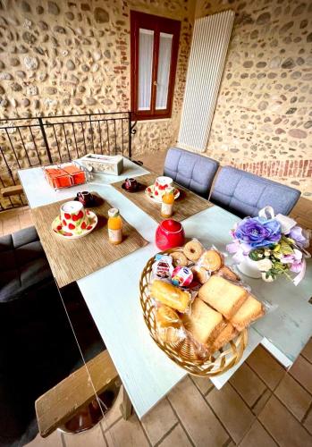 a table with a basket of food on it at Al Portico in Pove del Grappa