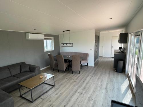 a living room with a couch and a table at Miva in Leiderdorp