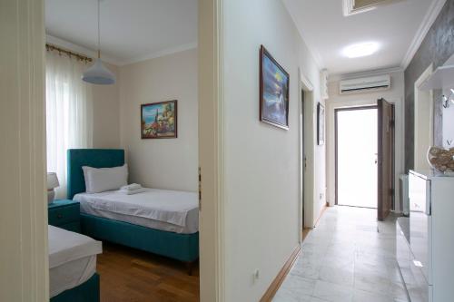 a small room with a bed and a hallway at Luxury Apartments Montesan in Sveti Stefan