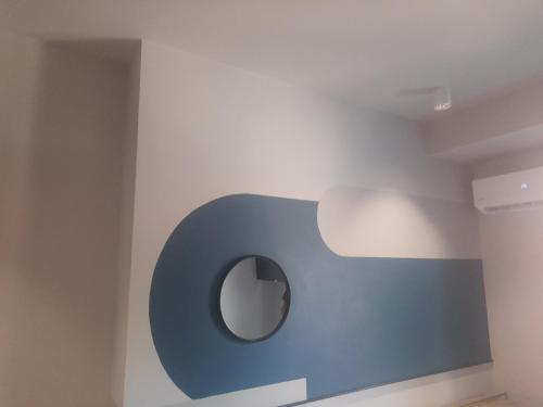 a bathroom with a blue sign on the wall at Mp luxury houses Α3 in Larisa