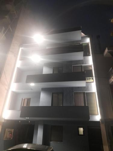 a tall building with lights on top of it at Mp luxury houses Α3 in Larisa